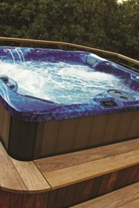 Blue spa in wood deck